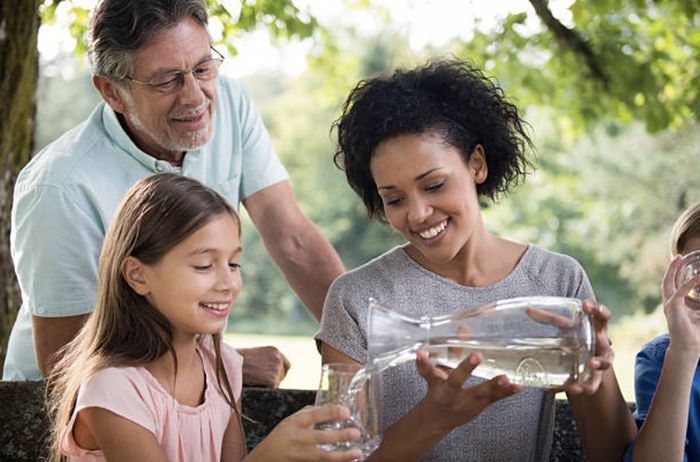 Family enjoying clean water at home